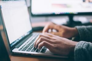 Laptop on a desk symbolizing how technology fits into daily work routines